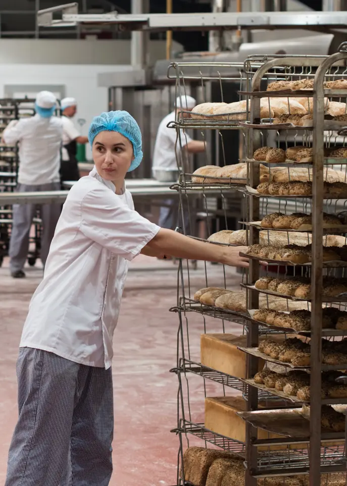Flourish bakers preparing freshly baked loaves